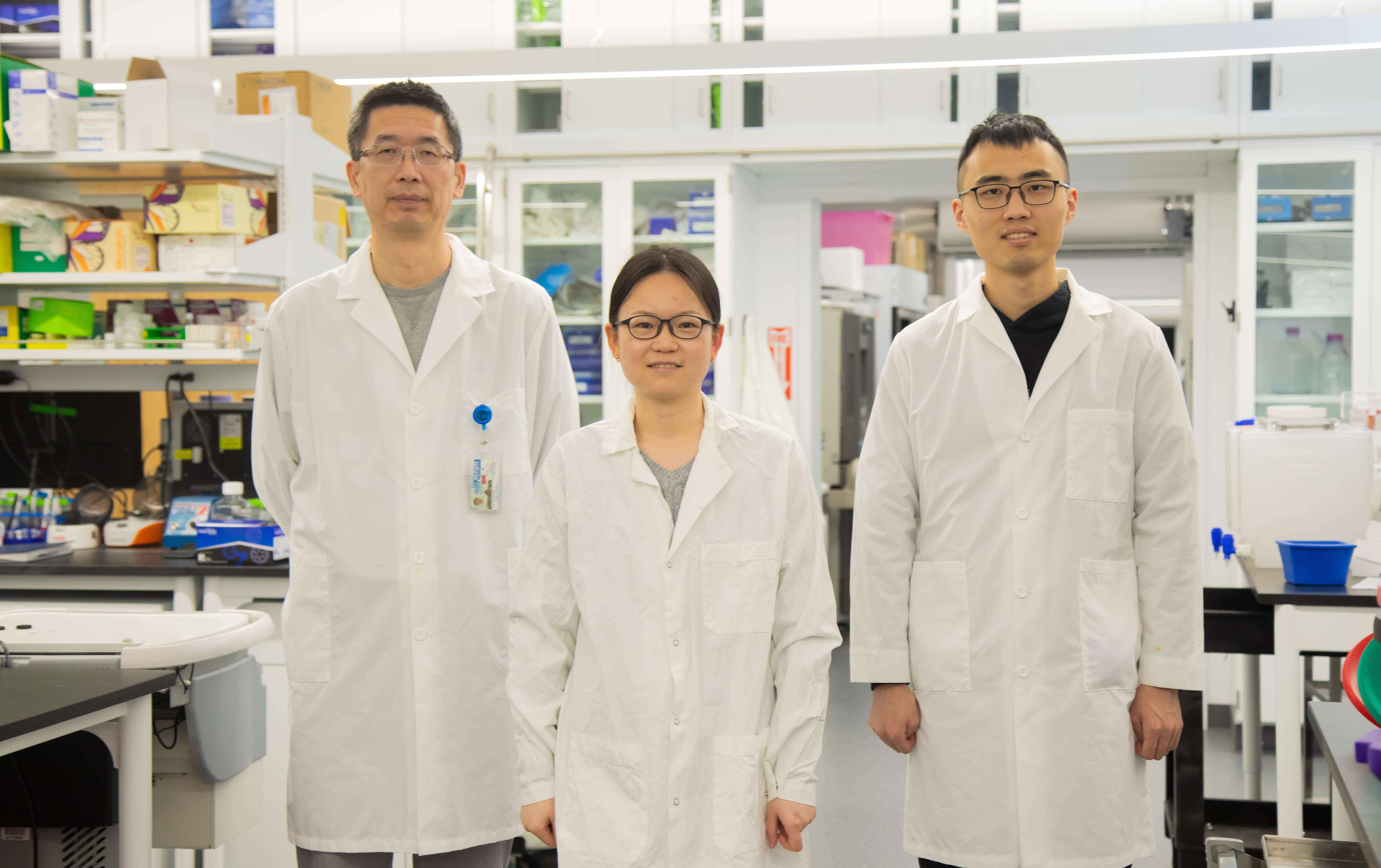 Sheng Tong, Xiaoyue Yang and Zhongchao Yi pose in laboratory.